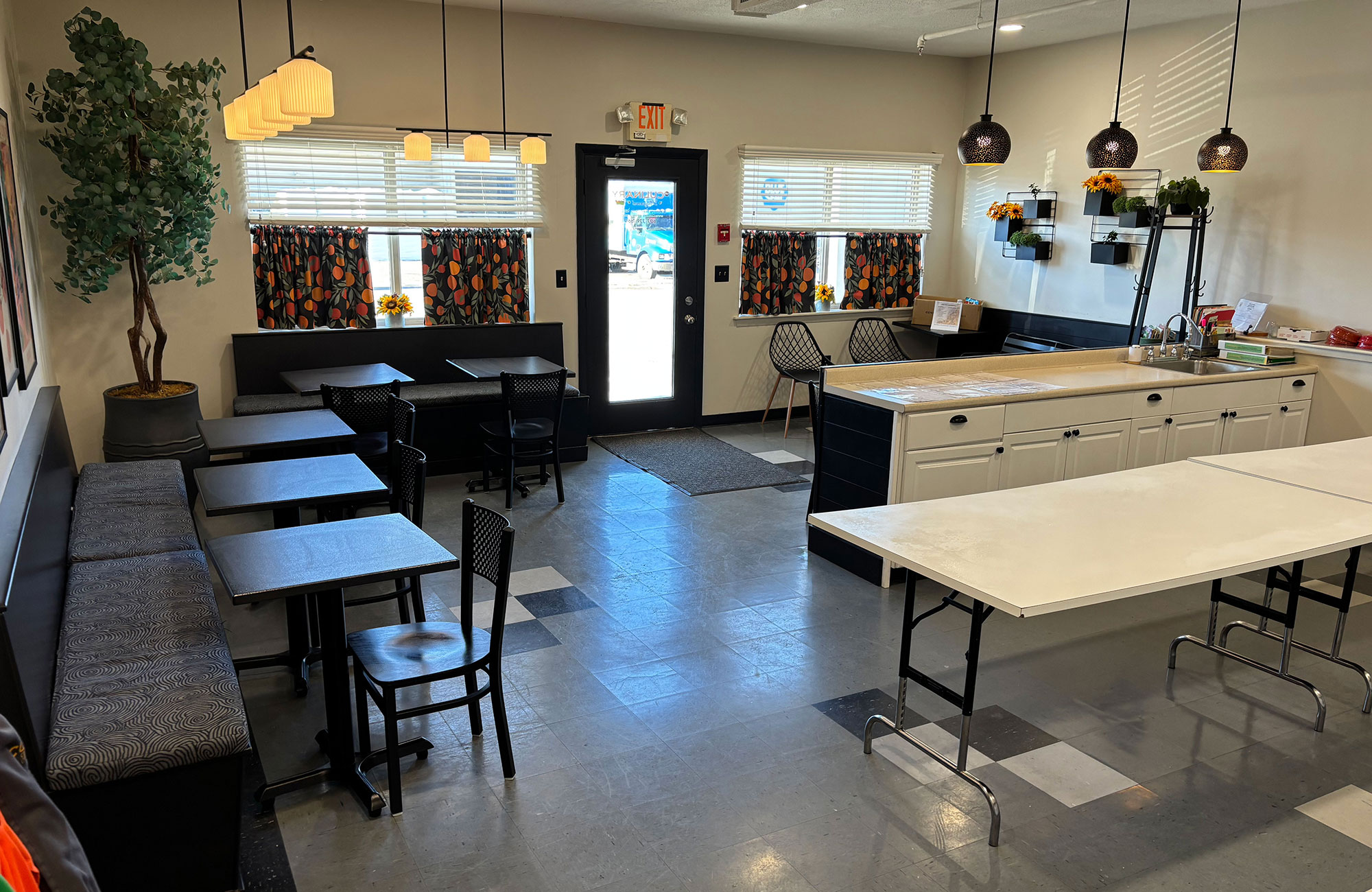 Kitchen classroom view showing the entrance and dining area where guests eat their food.