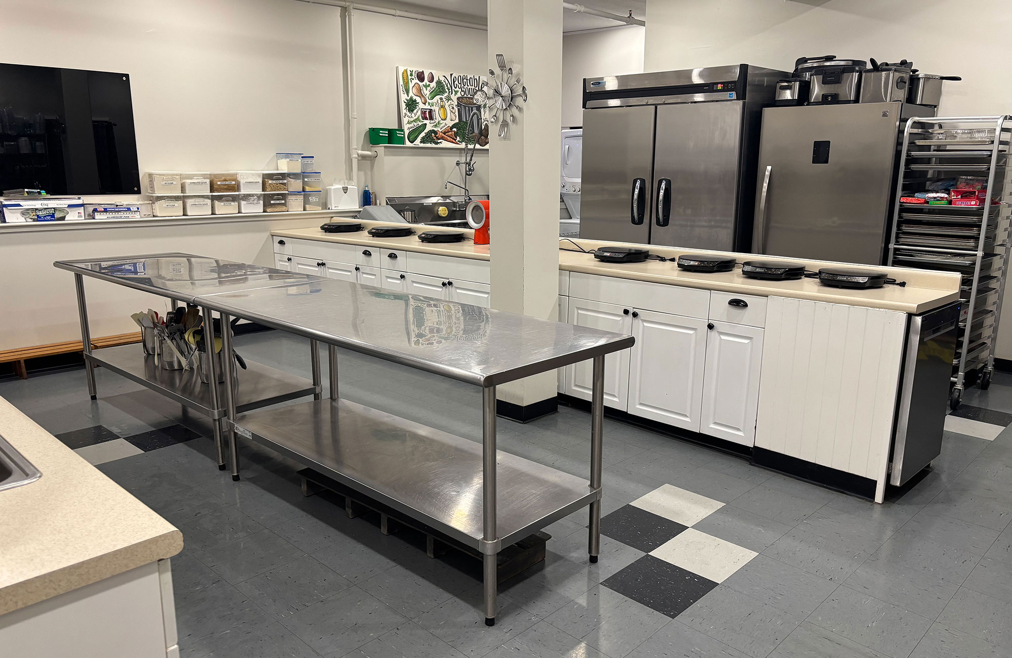 Kitchen classroom view showing cooking stations and equipment from other side o