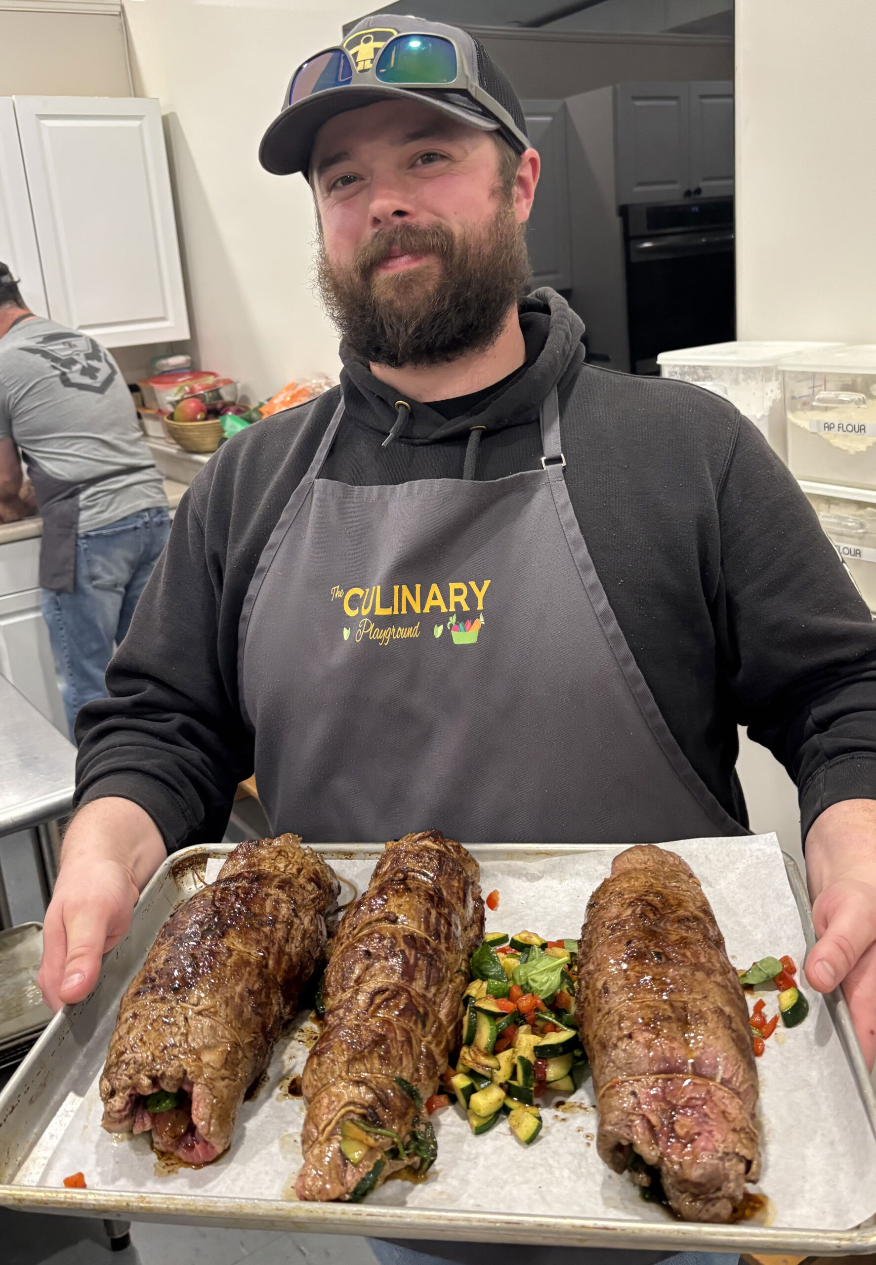 Man smiling with steak meal he made